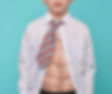 Young boy in shirt and tie with fake six-pack muscles