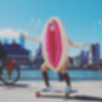 Woman in vulva costume on skateboard