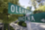 Streets signs in Bakersfield, California that say Oleander and Dracena