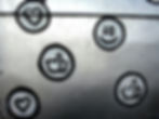 Drawings on a wall of hearts, thumbs up and a happy face