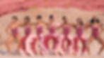 Still from the video Pynk by Janelle Monáe of women in the desert wearing curved vulva-shaped trousers